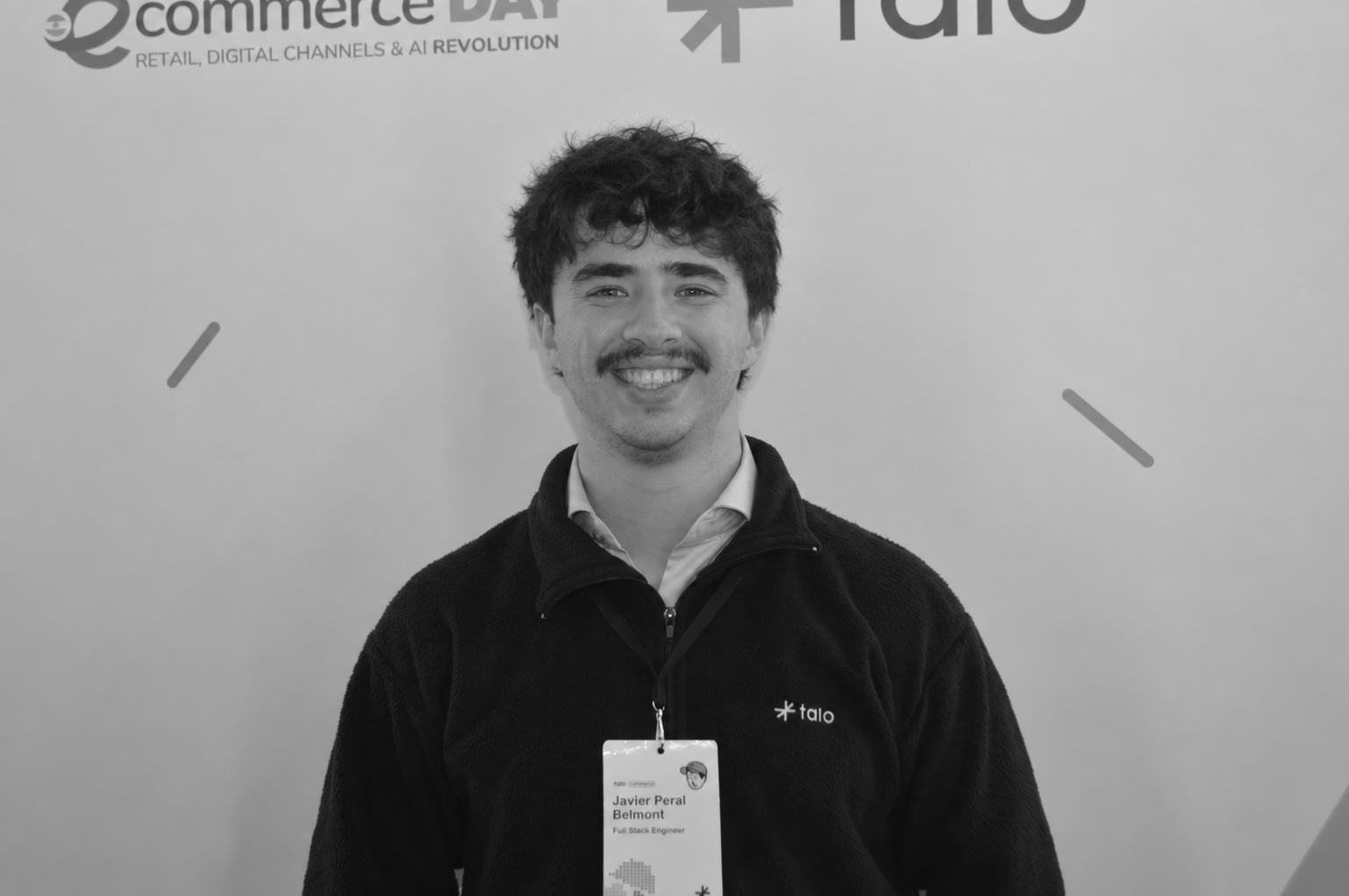 Black-and-white portrait of Javier smiling at eCommerce Day